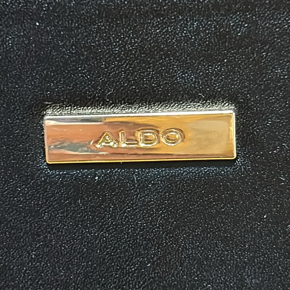 Aldo Faux leather handbag. Shoulder strap missing. Good condition. Black.